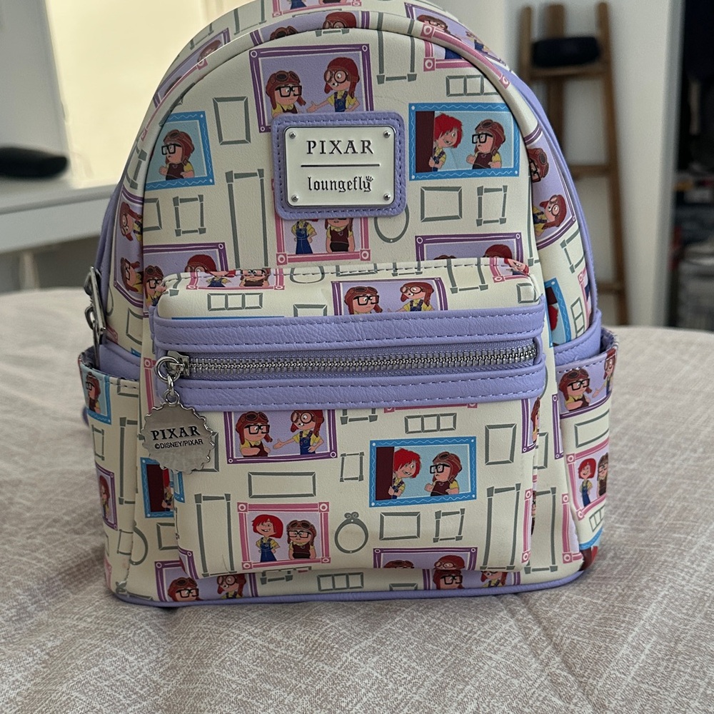 Loungefly Pixar Backpack - UP Portraits 
Purple and Cream